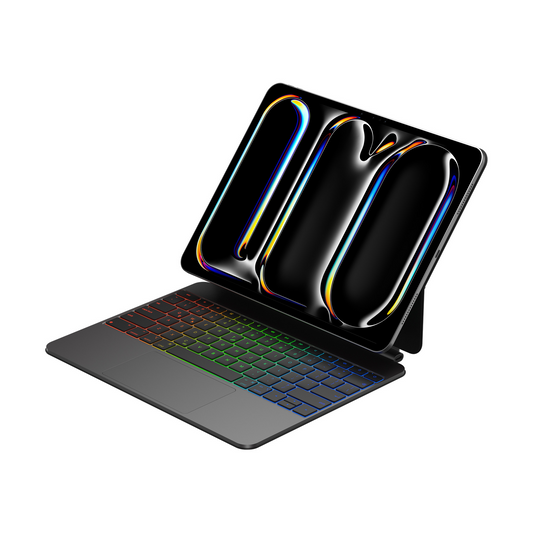 Close-up of Keypad Pro magnetic iPad keyboard with backlit keys illuminated in a dark room.